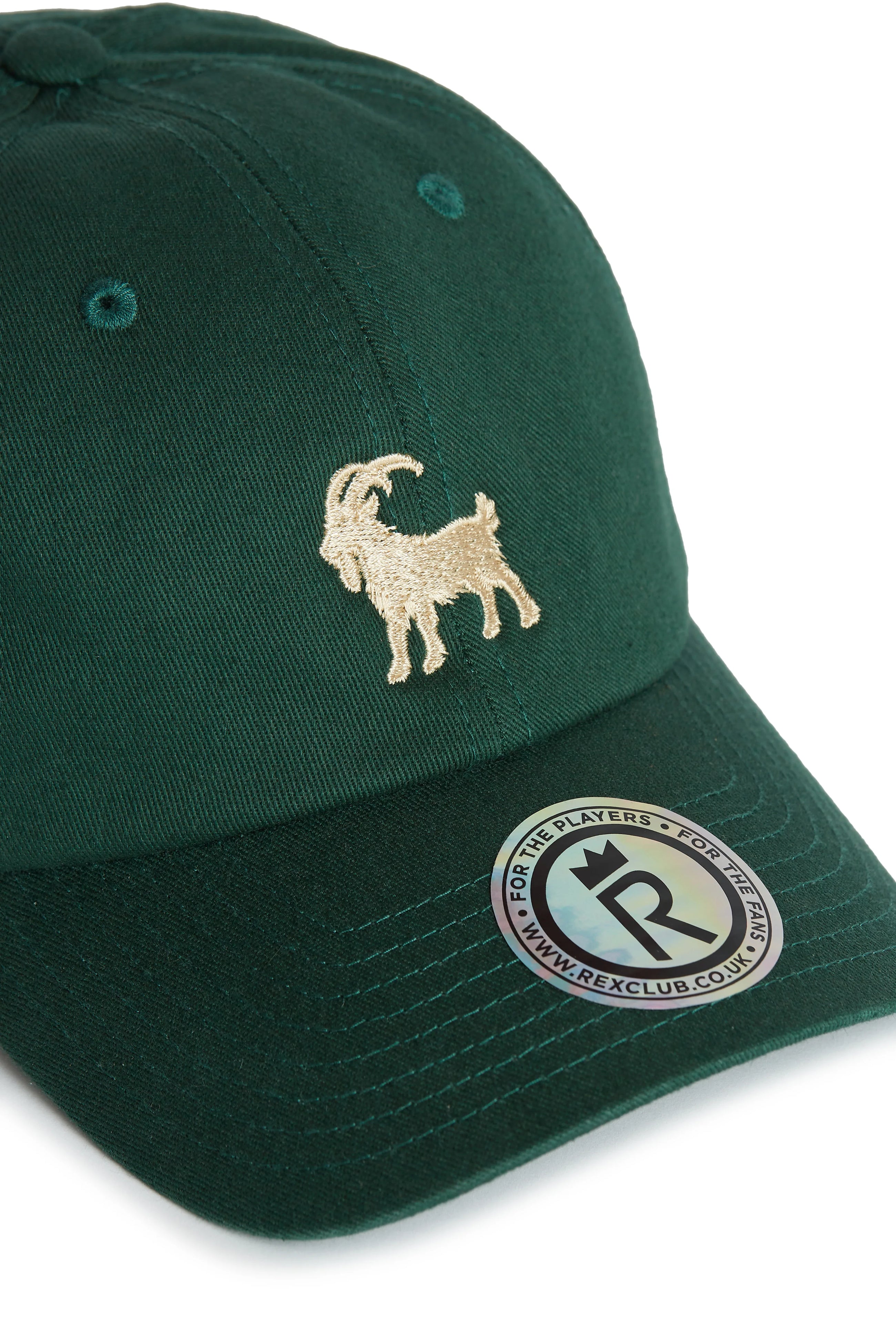 Rex Club | The Rex Club Goat - Dark Green cap features an embroidered gold goat on the front and a round brim sticker with "REXCLUB.CO.UK" and "FOR THE PLAYERS. | Custom Caps | Custom Hats | Team Headwear | UK