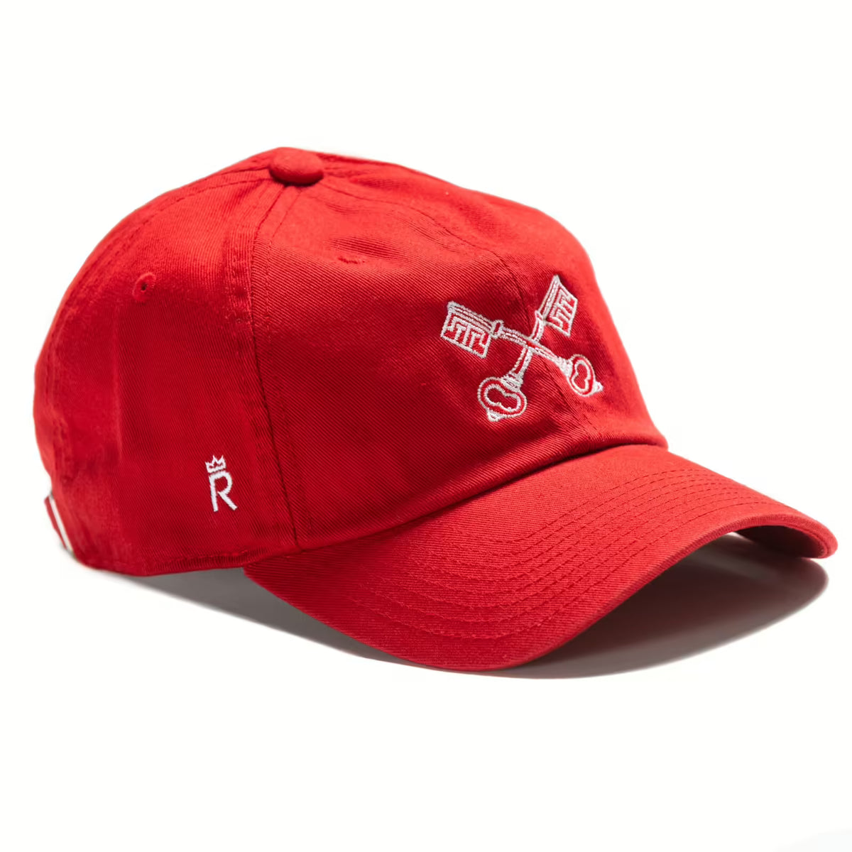 Rex Club | The Radley College - Slouch by Rex Club is a red 100% cotton baseball cap with two white crossed keys embroidered on the front and a small white "R" and crown logo on the side. | Custom Caps | Custom Hats | Team Headwear | UK