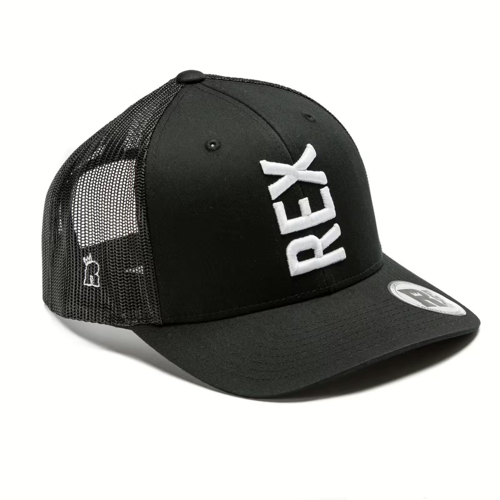 Rex Club | The Rex Club Tilted - Trucker, Black / White features bold vertical "REX" embroidery in white on the front, a mesh back, a small side logo, and a sticker on the brim. | Custom Caps | Custom Hats | Team Headwear | UK