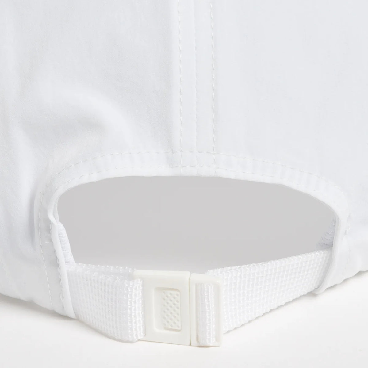 Rex Club | Close-up of the back of a Rex Club Running Cap in white polyester, featuring an adjustable strap with a white plastic buckle and stitched seams. | Custom Caps | Custom Hats | Team Headwear | UK