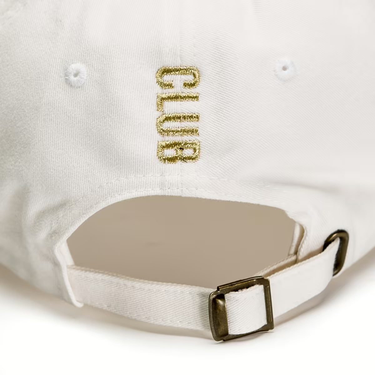 Rex Club | Close-up of the Rex Club Tilted cap’s back, showing "CLUB" in gold embroidery above an adjustable strap and brass buckle for a custom fit. White slouch fit by Rex Club. | Custom Caps | Custom Hats | Team Headwear | UK