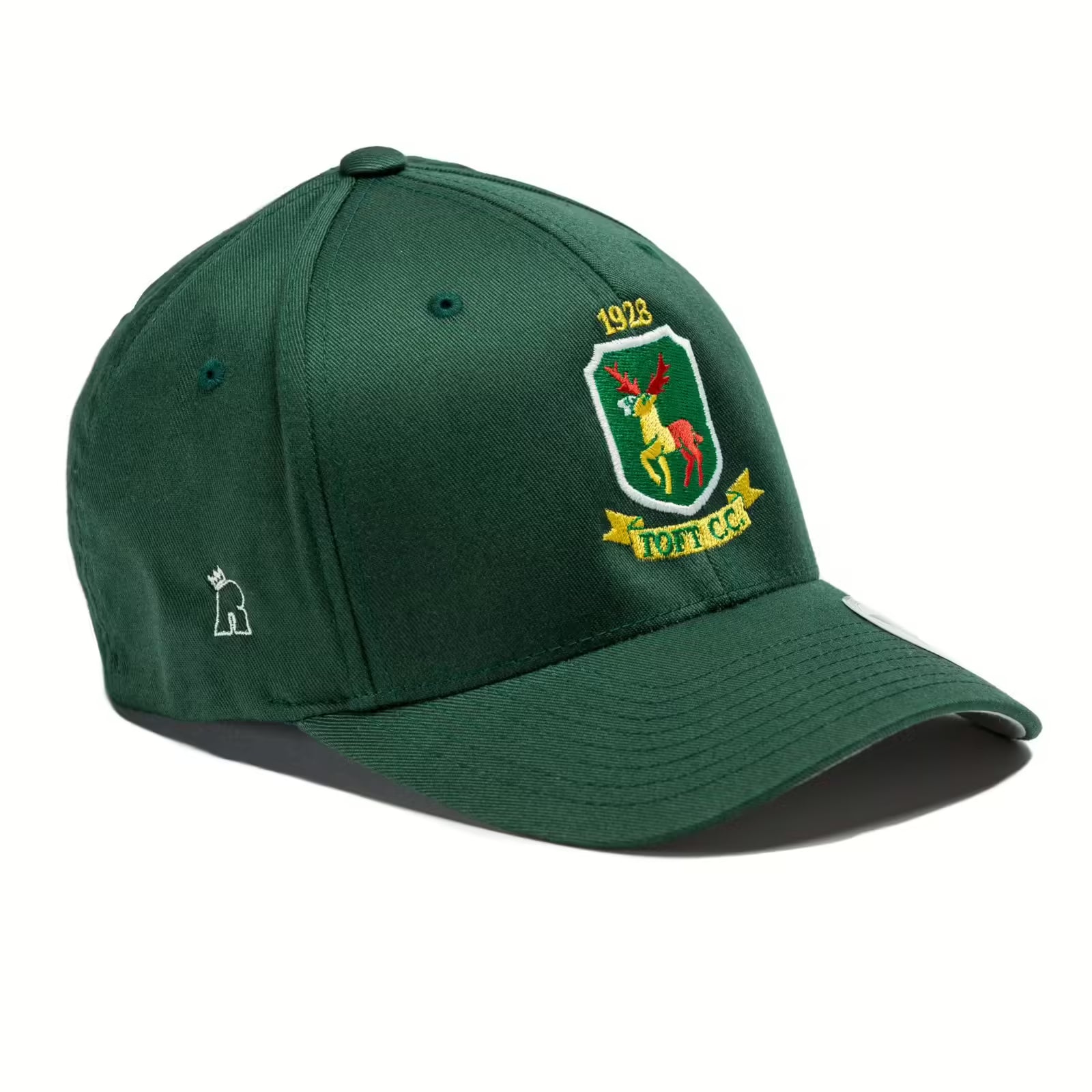 Rex Club | The Rex Club Toft CC - Club Crest is a green stretch-fit baseball cap with an embroidered deer badge, “1913,” and “Toft CC” on the front—perfect for Cheshire cricket fans. A small white animal logo accents the side. | Custom Caps | Custom Hats | Team Headwear | UK