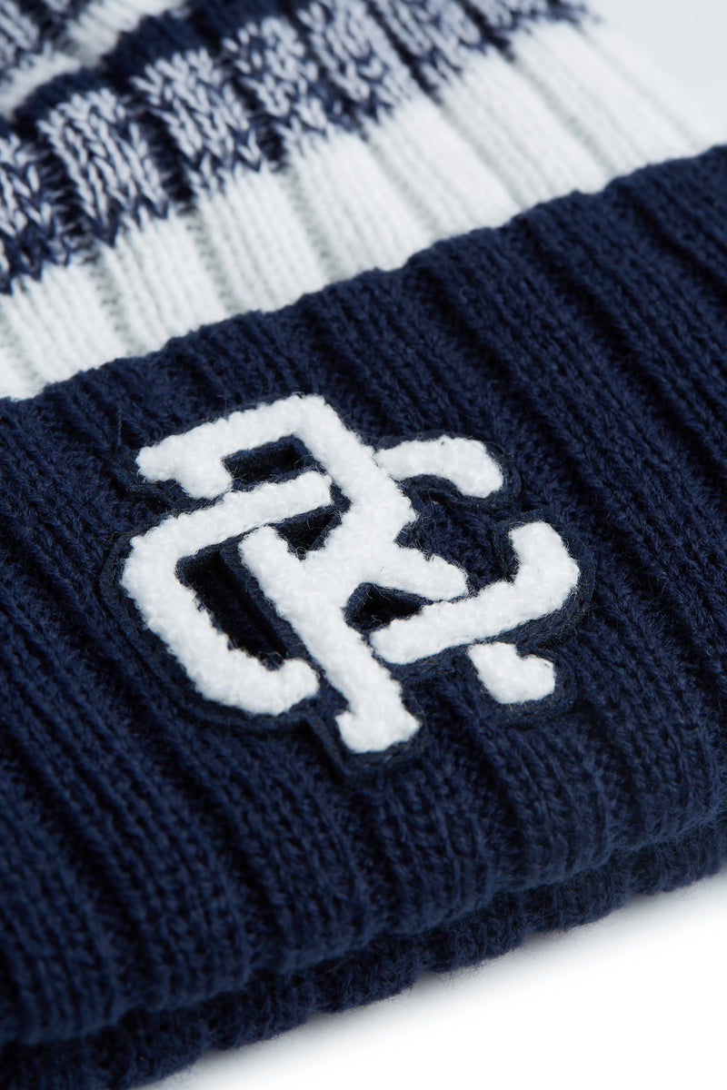 Rex Club | Close-up of the Rex Club - Navy/White hat featuring navy and white stripes and a chenille "RC" patch on the navy ribbed cuff. Brand: Rex Club. | Custom Caps | Custom Hats | Team Headwear | UK