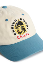 Rex Club | Introducing the Exeter Chiefs - Two Tone by Rex Club: a premium, bespoke baseball cap in cream and teal, expertly crafted from 100% cotton. This stylish headwear features an embroidered Exeter Chiefs helmet logo on the front, accented by “Exeter Rugby” in black and “Chiefs” in red beneath the image. | Custom Caps | Custom Hats | Team Headwear | UK