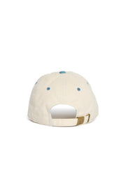 Rex Club | A rear view of the Exeter Chiefs - Two Tone cap by Rex Club, showcasing its beige color, brass adjustable strap, and blue stitched eyelets. Made from 100% cotton, this premium bespoke headwear offers fans of the Exeter Chiefs a perfect blend of comfort and style. | Custom Caps | Custom Hats | Team Headwear | UK