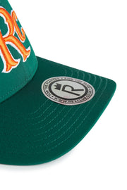 Rex Club | Close-up of the green RC 26 Performance cap by Rex Club, featuring orange embroidery and a silver "Rex Club" sticker with logo and website—ideal for sports teams wanting distinctive monogram styles. | Custom Caps | Custom Hats | Team Headwear | UK