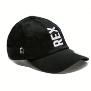 Rex Club | The Rex Club Tilted - Slouch, Black cap features "REX" embroidered vertically in bold white letters on the front and a small crowned bear design on the side. | Custom Caps | Custom Hats | Team Headwear | UK