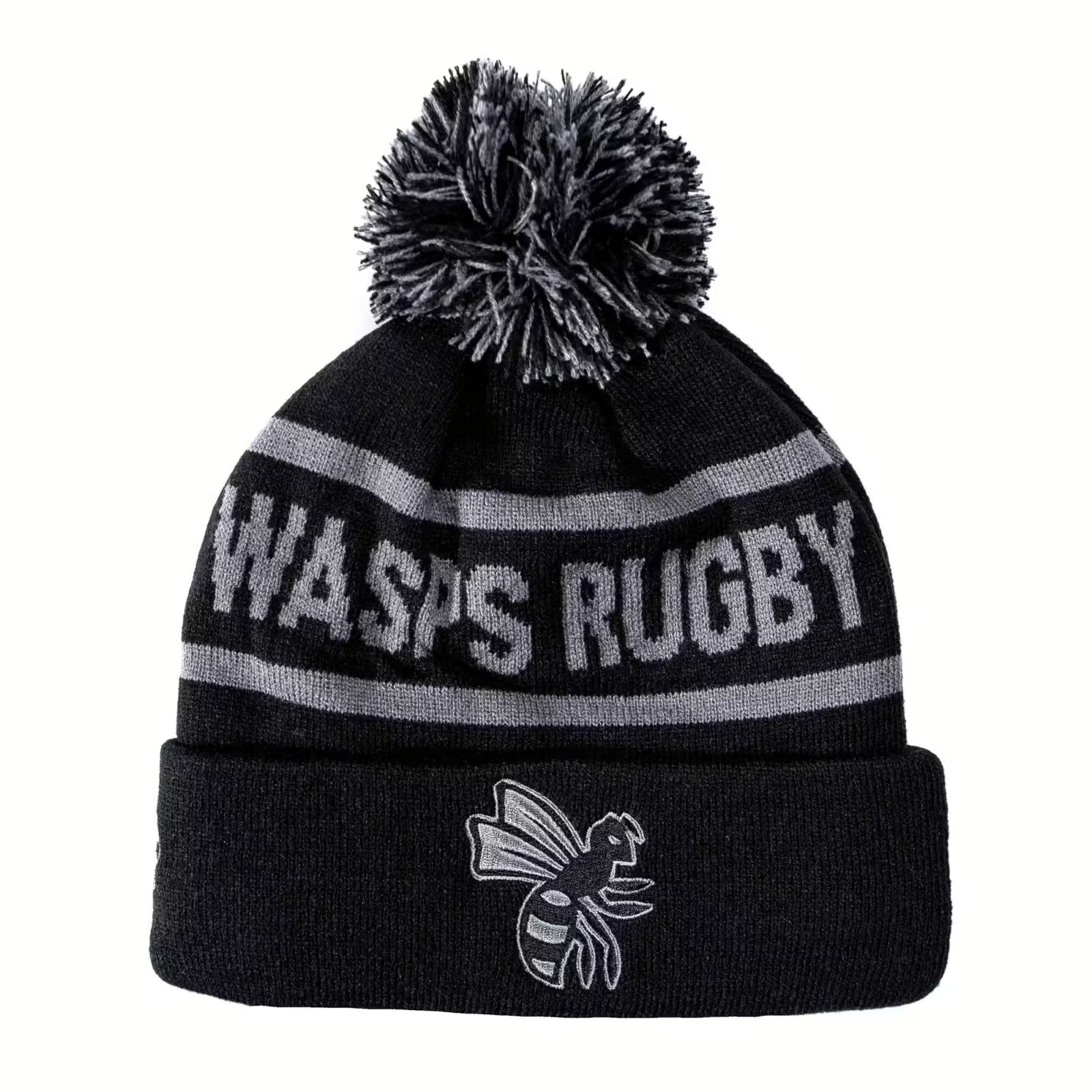 Rex Club | The Rex Club Wasps Bobble is a black and gray knit beanie with a pom-pom, "WASPS RUGBY" text, cartoon wasp logo on the cuff, and cozy fleece lining. | Custom Caps | Custom Hats | Team Headwear | UK