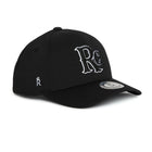 Rex Club | The RC 26 Performance cap by Rex Club is a black baseball hat with bold white "RC" monogram embroidery, a crown-topped "R" on the side, and a round sticker on the curved brim—ideal for sports teams or classic style enthusiasts. | Custom Caps | Custom Hats | Team Headwear | UK
