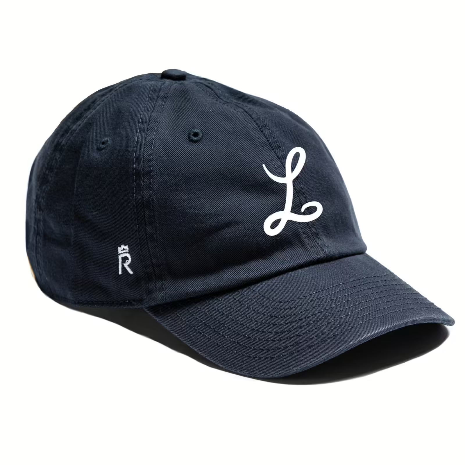 Rex Club | The Ludgrove by Rex Club is a navy blue pure cotton baseball cap with a large white cursive "L" on the front and a small crowned embroidered "R" on the side. | Custom Caps | Custom Hats | Team Headwear | UK