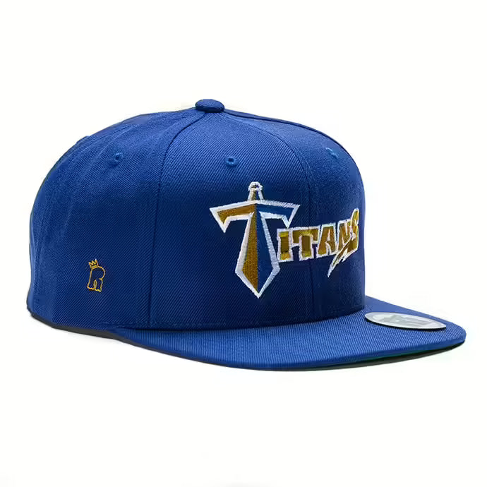 Rex Club | The Rex Club Manchester Titans 2019 snapback features royal blue fabric, a bold gold and white "Titans" logo on the front, and a small gold crown on the side—an ideal sideline cap for fans. | Custom Caps | Custom Hats | Team Headwear | UK