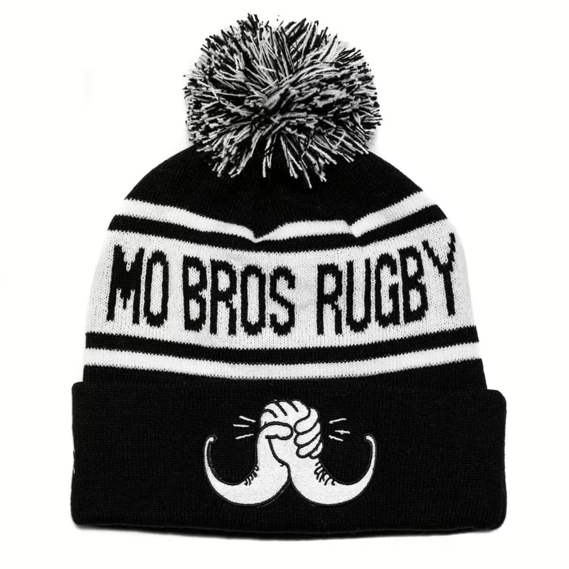 Rex Club | The Rex Club Mo Bros Rugby Bobble is a black and white knit beanie with a pom-pom, featuring "MO BROS RUGBY" across it and an embroidered mustache being twisted by two hands on the front. | Custom Caps | Custom Hats | Team Headwear | UK