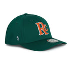 Rex Club | The RC 26 Performance by Rex Club is a green baseball cap featuring an orange and white "RC" logo on the front, a small crowned "R" monogram on the side, and a circular brim sticker—ideal for sports fans. | Custom Caps | Custom Hats | Team Headwear | UK