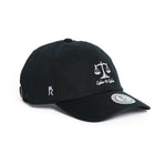 Rex Club | The Labor Et Ludus cap by Rex Club is a black baseball hat featuring an embroidered scales of justice and “Labor Et Ludus” on the front, a small crowned “R” on the side, and a round silver sticker on the brim. Made from 100% cotton, this one-size-fits-most cap delivers comfort and style for everyday work or play. | Custom Caps | Custom Hats | Team Headwear | UK
