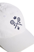 Rex Club | The Rex Club MTRC – White baseball cap features an embroidered design of two crossed tennis rackets, a small crown, “1876,” and a fleur-de-lis in navy blue on the front—a stylish piece of club merchandise perfect for fans of classic sportswear or collectors of Manchester Tennis & Racquets Club caps. | Custom Caps | Custom Hats | Team Headwear | UK