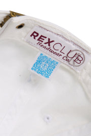 Rex Club | Close-up of the inside of the MTRC – White cap by Rex Club, a popular club merchandise item, featuring a “REX CLUB Headwear co.” label and a blue QR code tag with a small icon next to the metal adjustment buckle. | Custom Caps | Custom Hats | Team Headwear | UK