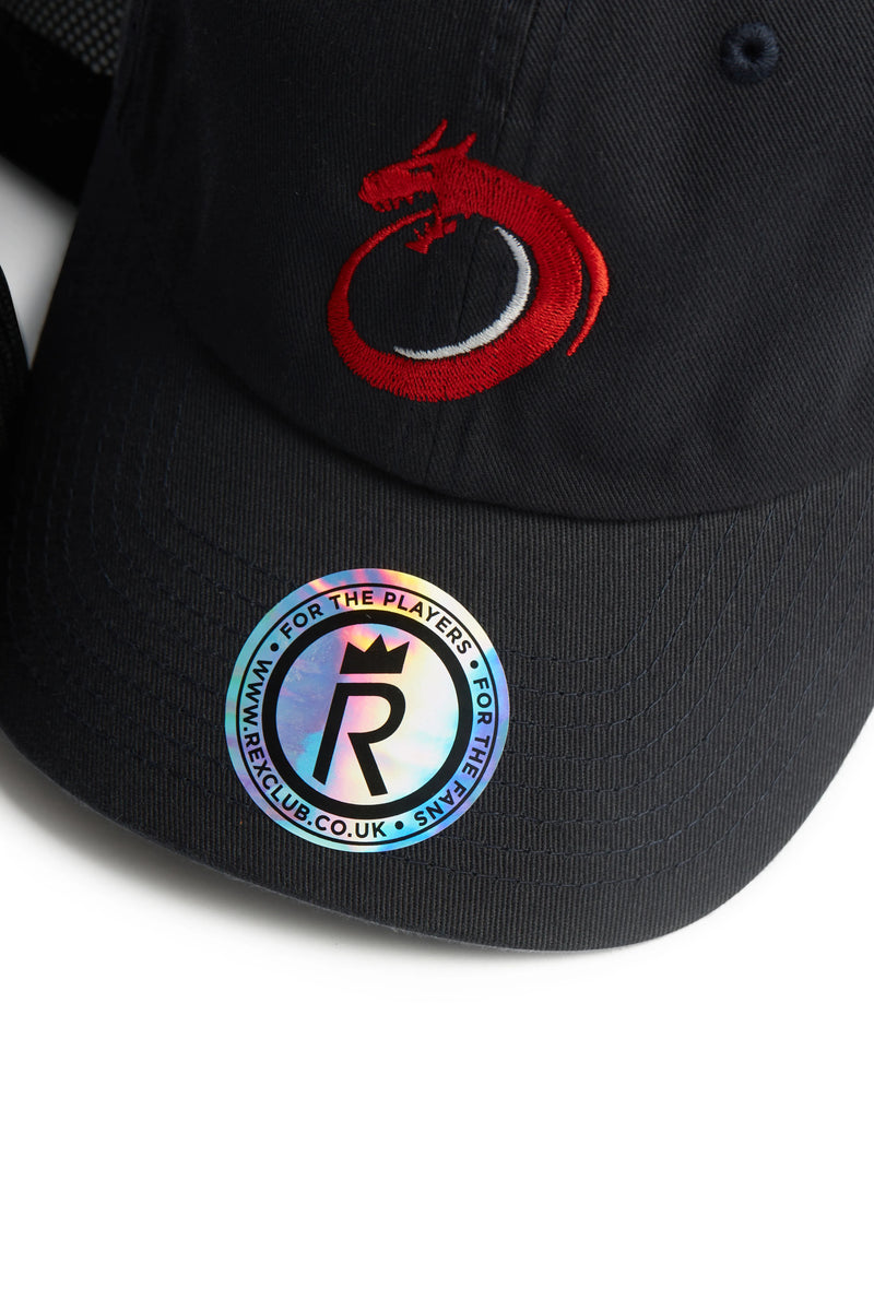 Rex Club | The Norway Rugby Stretch by Rex Club is a black cap with a red embroidered dragon logo and a shiny round sticker reading "FOR THE PLAYERS", "R", and "RARECLUB.CO.UK"—the perfect accessory for Rugby Europe and Norway rugby fans. | Custom Caps | Custom Hats | Team Headwear | UK