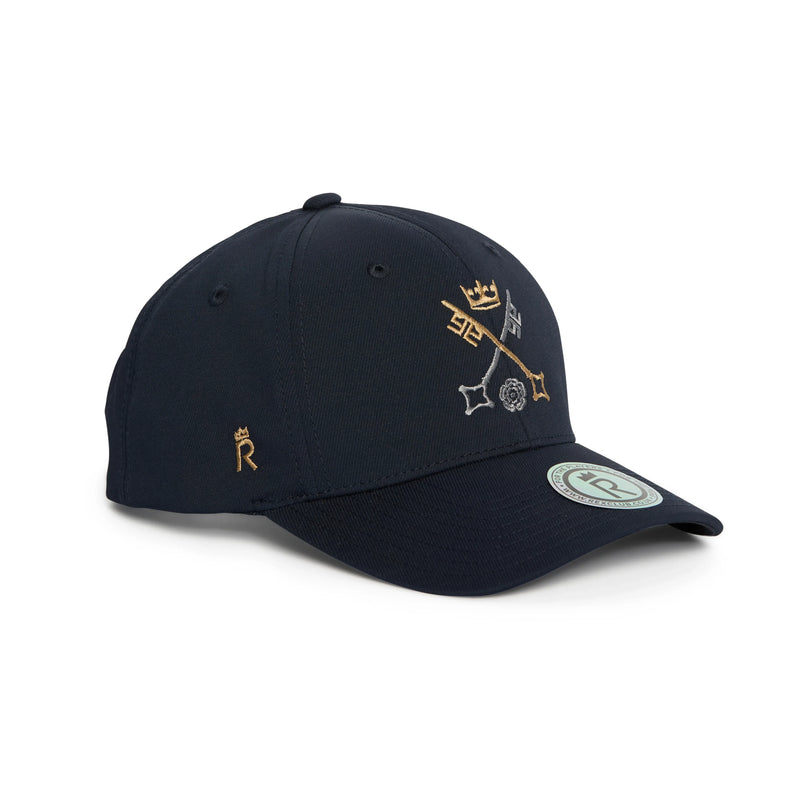 Rex Club | A navy blue St Peter's York baseball cap by Rex Club, featuring golden embroidered symbols and a small "R" on the side. Celebrating the distinguished heritage of St Peter's School, York—recognized as the third-oldest school in the world—the cap displays a round logo sticker on the brim and is positioned at a slight angle. | Custom Caps | Custom Hats | Team Headwear | UK