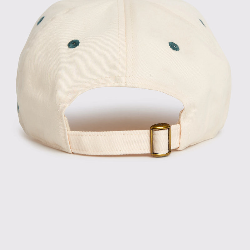 Rex Club | A close-up of the RC - Two/Tone - SS26 Green baseball cap by Rex Club, cream-colored and 100% cotton, with a metal adjustable strap, dark green eyelets, and a one-size-fits-most fit, shown on a plain light background. | Custom Caps | Custom Hats | Team Headwear | UK