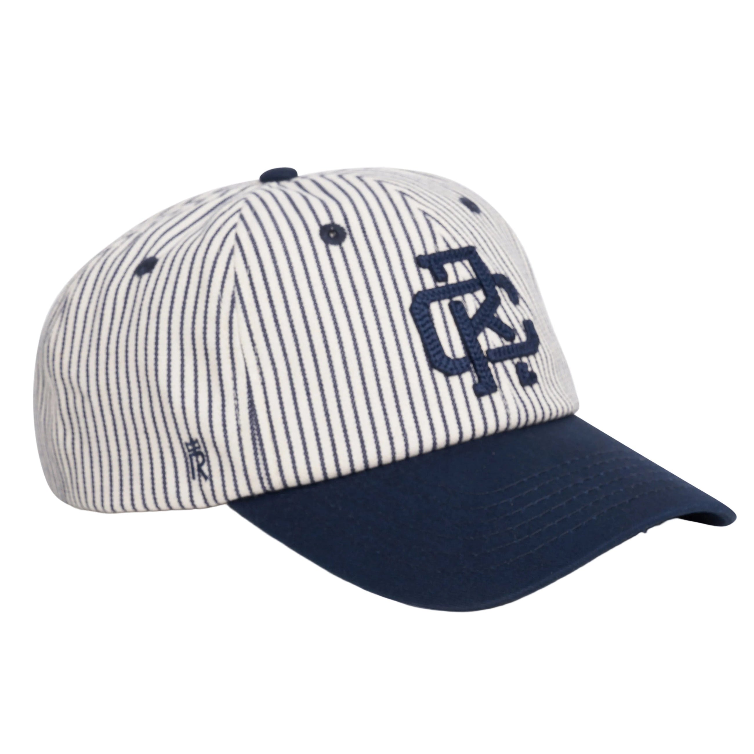 Rex Club | Introducing the RC - Baseball Pin - SS26 Navy cap by Rex Club: This white cotton baseball cap features thin navy blue vertical stripes, a solid navy blue brim, and a large embroidered logo on the front in navy. Designed for comfort with an adjustable strap, this one-size-fits-most cap combines style and versatility. | Custom Caps | Custom Hats | Team Headwear | UK