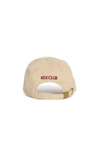 Rex Club | RC 3d 26 - Beige cap from Rex Club, shown from the back, featuring “REX CLUB” in red 3D embroidery above the adjustable strap and buckle. | Custom Caps | Custom Hats | Team Headwear | UK