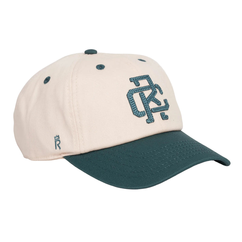 Rex Club | The RC - Two/Tone - SS26 Green by Rex Club is a beige, 100% cotton baseball cap with a dark green curved brim, embroidered "RC" on the front, and a small dark green “R” near the base. One size fits most. | Custom Caps | Custom Hats | Team Headwear | UK
